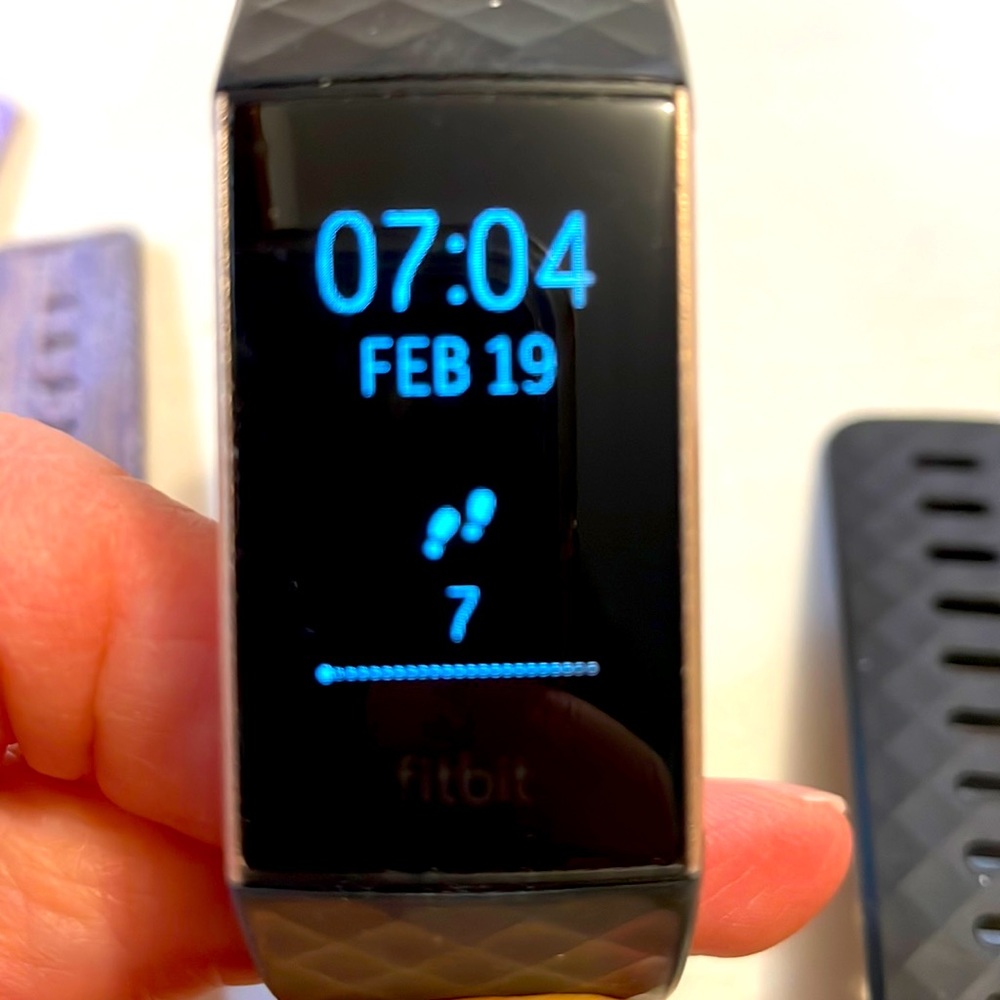 Fitbit Charge 3 HR with 3 bands and charger, rose gold.